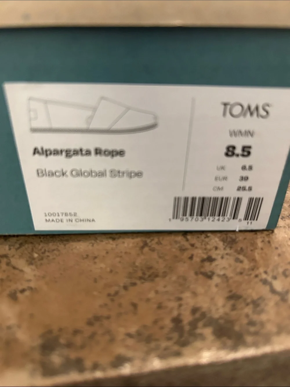 TOMS. Black striped espadrilles, size 8 and a half.  Excellent condition.